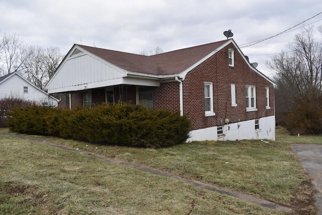 view of home's exterior with a lawn