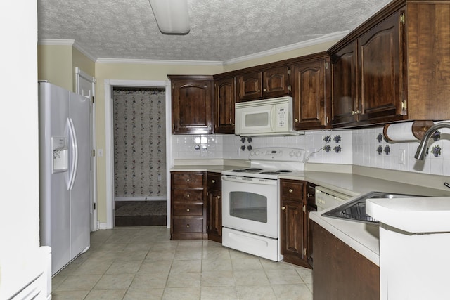 kitchen with tasteful backsplash, light tile patterned floors, dark brown cabinetry, crown molding, and white appliances