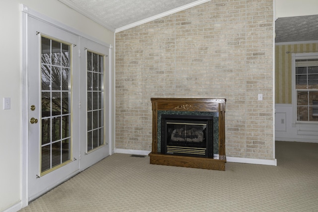 unfurnished living room featuring lofted ceiling, crown molding, a textured ceiling, and carpet