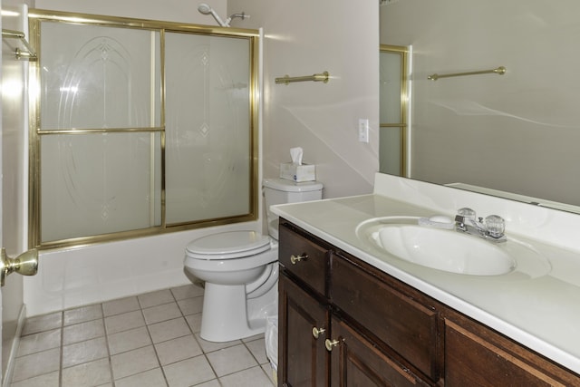 full bathroom featuring toilet, vanity, bath / shower combo with glass door, and tile patterned flooring