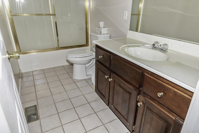 full bathroom with vanity, toilet, tile patterned flooring, and combined bath / shower with glass door