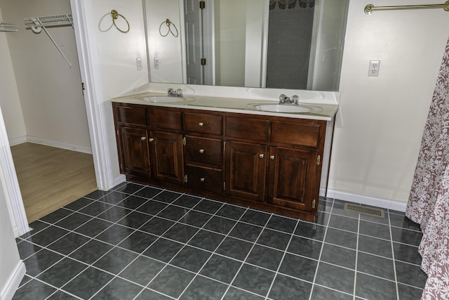 bathroom featuring vanity and tile patterned flooring