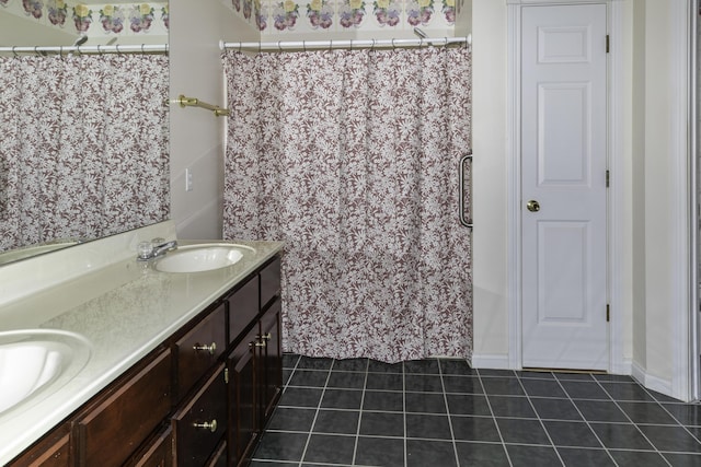 bathroom with tile patterned flooring and vanity