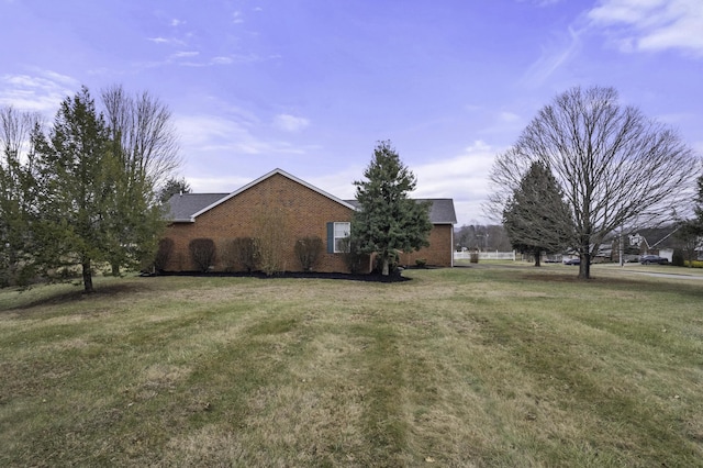 view of property exterior featuring a yard