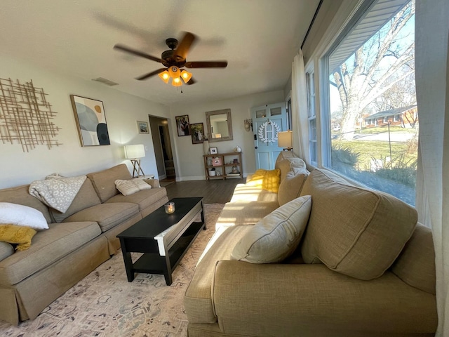 living room with ceiling fan and light hardwood / wood-style floors