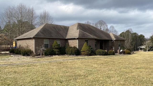 view of side of property featuring a yard