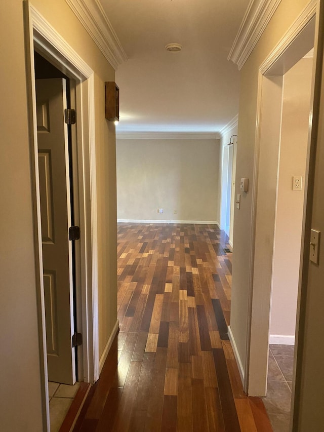 hallway with crown molding and dark hardwood / wood-style floors