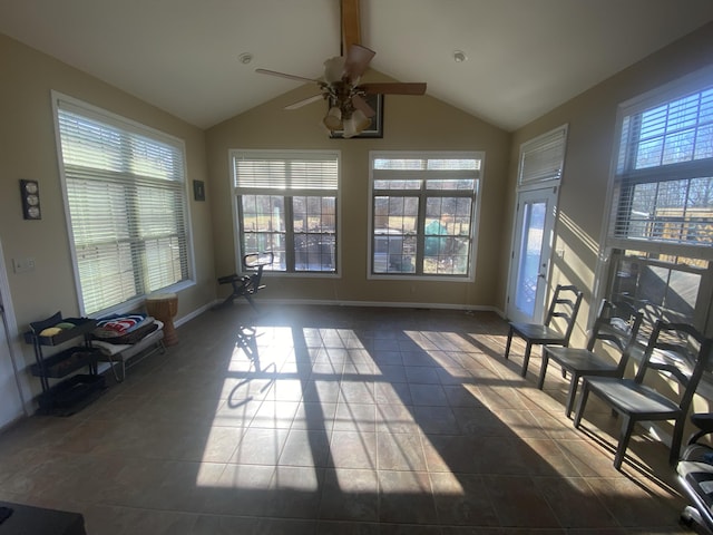 unfurnished sunroom featuring lofted ceiling with beams