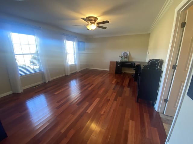 spare room with ornamental molding, dark wood-type flooring, and ceiling fan