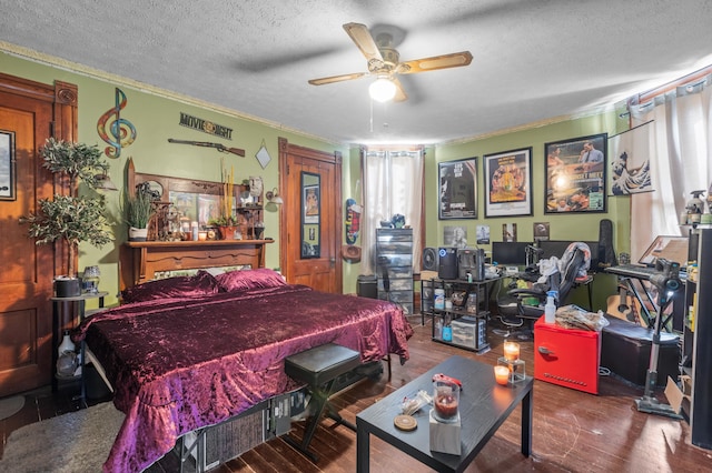 bedroom with hardwood / wood-style floors, crown molding, and a textured ceiling