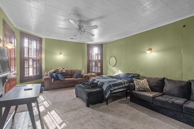 living room featuring ceiling fan and light colored carpet