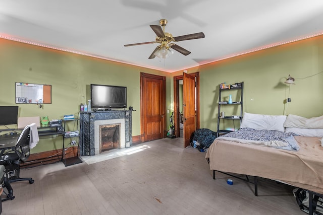 bedroom featuring ceiling fan and light wood-type flooring