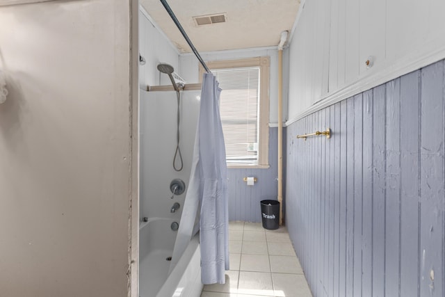 bathroom with shower / tub combo and tile patterned flooring