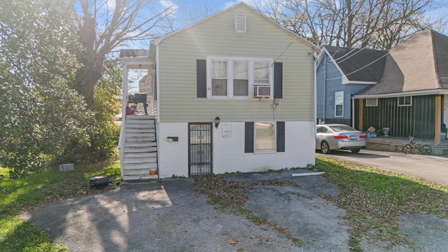 view of front of home featuring cooling unit