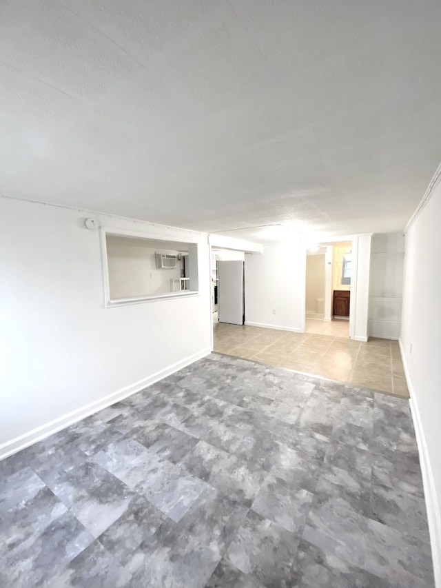 spare room with a wall mounted air conditioner