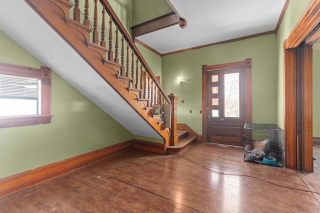 entrance foyer with wood-type flooring and ornamental molding