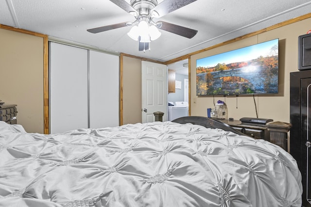 bedroom featuring washer / dryer, ornamental molding, a closet, and ceiling fan