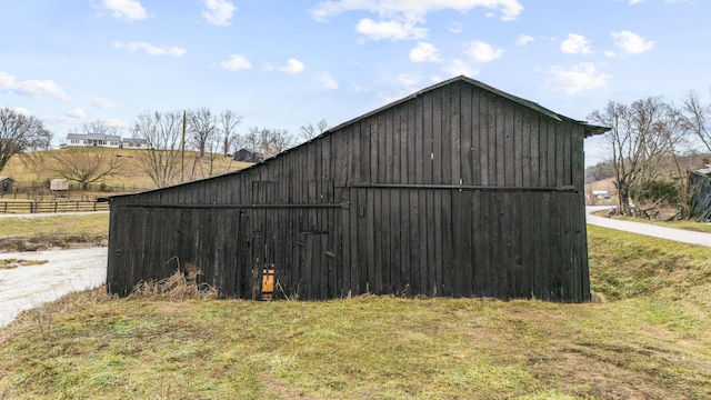 view of outdoor structure featuring a lawn