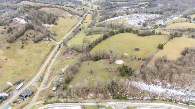 birds eye view of property with a rural view