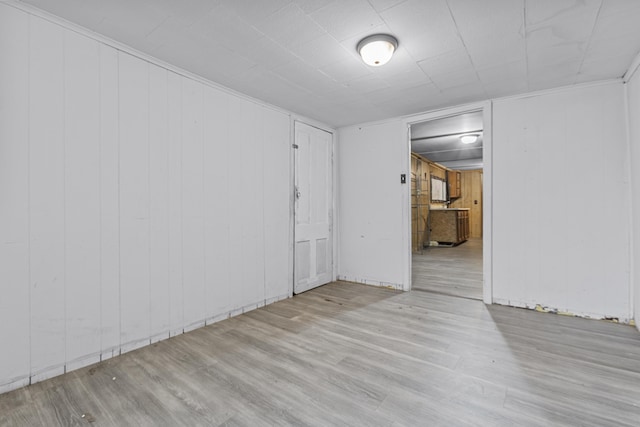 empty room with light hardwood / wood-style floors