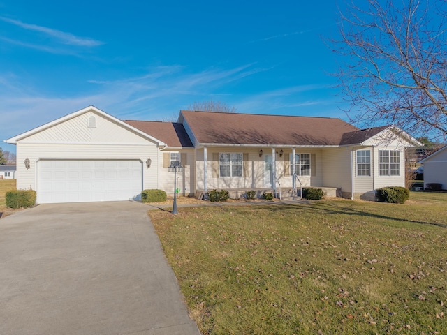 ranch-style house featuring a garage, covered porch, and a front yard