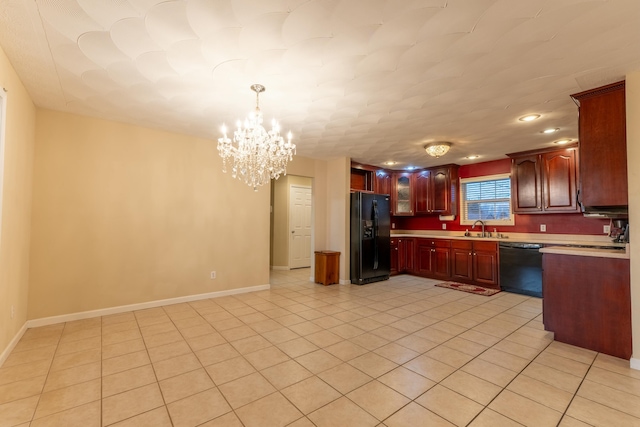 kitchen with sink, light tile patterned floors, hanging light fixtures, a notable chandelier, and black appliances