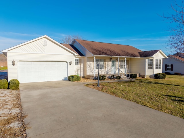 ranch-style house featuring a garage, a porch, and a front yard