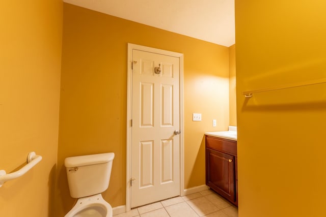 bathroom featuring tile patterned floors, toilet, and vanity