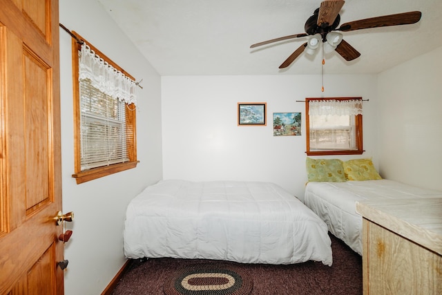 bedroom featuring ceiling fan and carpet floors