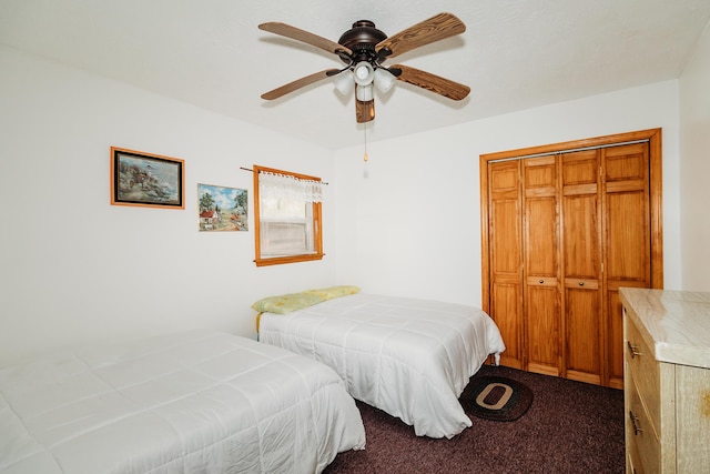 bedroom featuring ceiling fan, a closet, and carpet