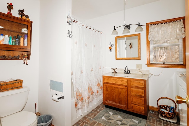 full bathroom featuring vanity, shower / tub combo, and toilet