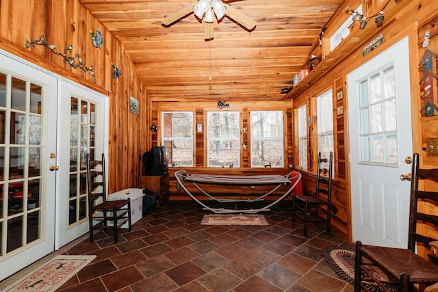 sunroom with vaulted ceiling, wood ceiling, and french doors