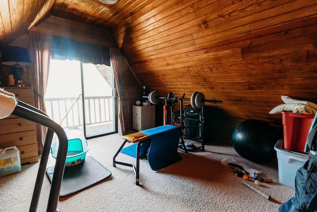 workout area with lofted ceiling, wooden walls, carpet, and wooden ceiling