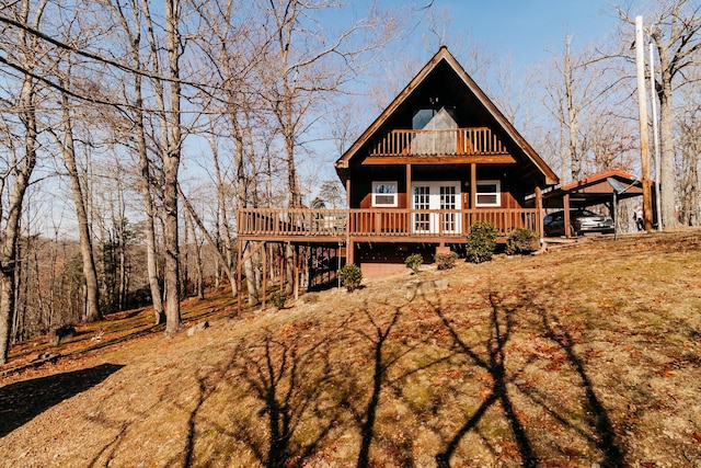 rear view of property with a carport