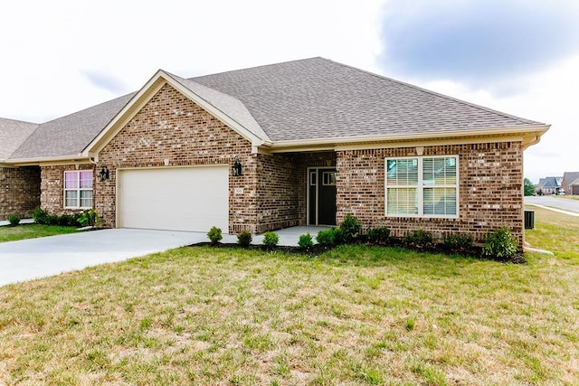 single story home with a garage and a front lawn