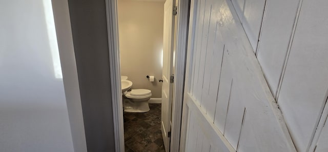 bathroom featuring toilet