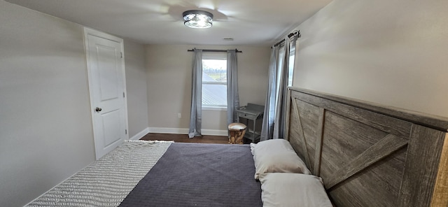 bedroom featuring dark wood-type flooring