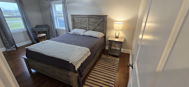 bedroom featuring dark wood-type flooring