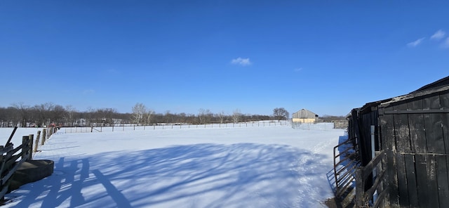 view of yard layered in snow