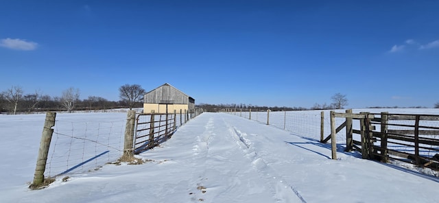 view of dock with a rural view