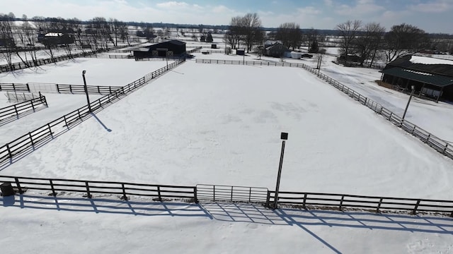 snowy aerial view featuring a rural view