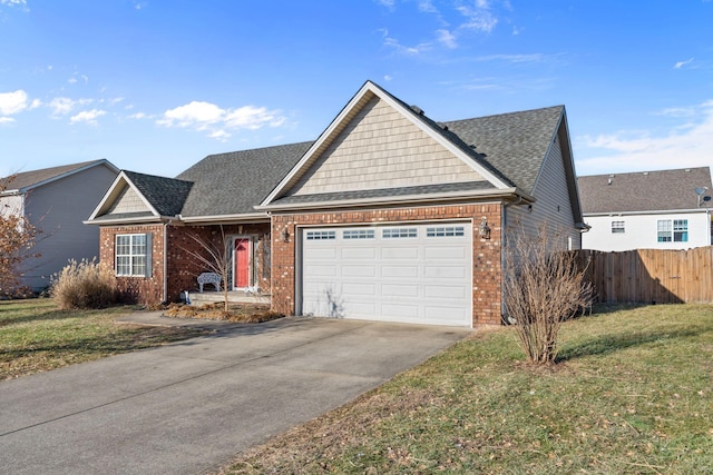 view of front of property featuring a garage and a front yard