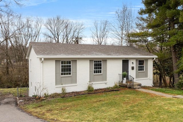 ranch-style house with a front yard