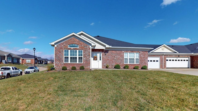 view of front of home featuring a garage and a front yard