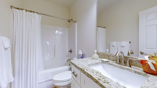 full bathroom featuring vanity, shower / bath combination with curtain, and toilet