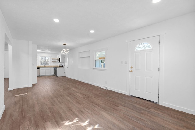 foyer entrance featuring dark hardwood / wood-style floors