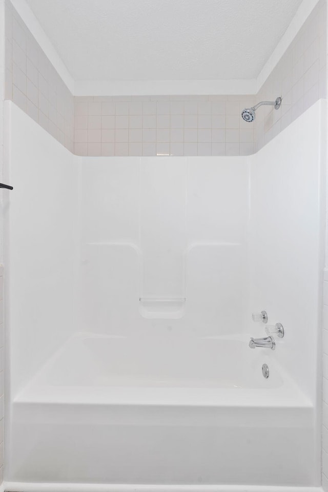 bathroom with shower / washtub combination