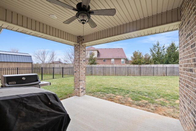 view of patio featuring a fenced backyard, ceiling fan, and area for grilling