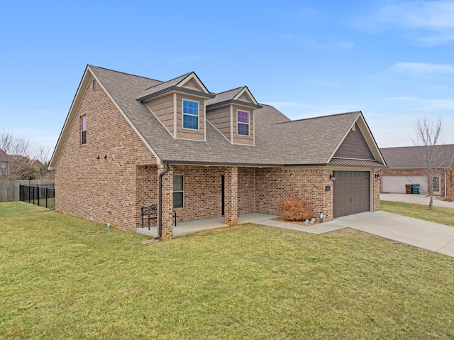 view of front facade featuring driveway, a front lawn, and brick siding