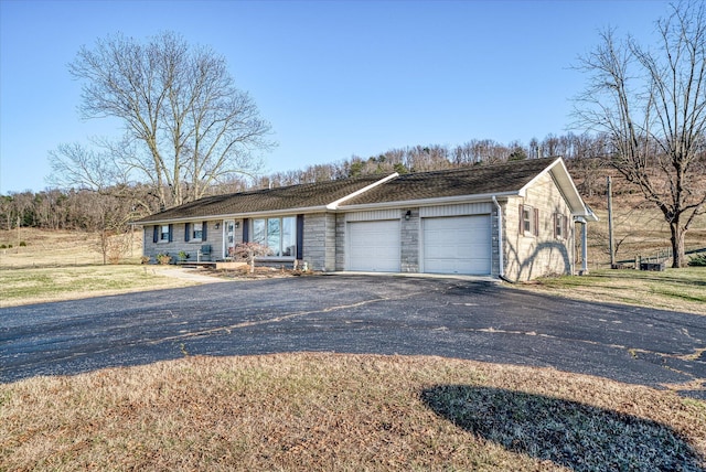 single story home featuring a garage